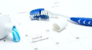 9172902 - a note of a dentist appointment on a calendar reminds the patient.